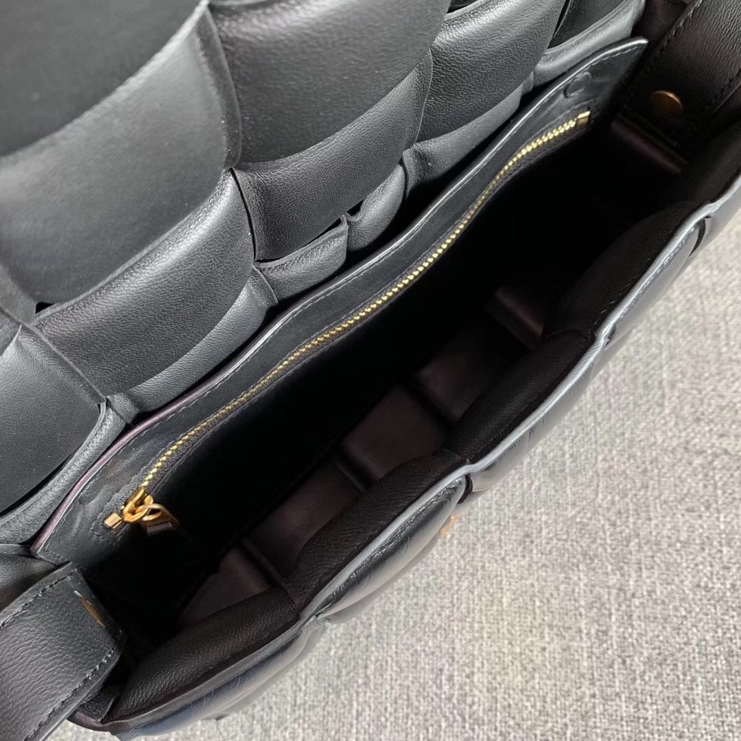 bo*te*ga Ve*ne*ta padded cassette bag in black calfskin