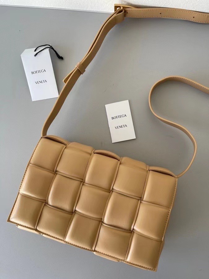 bo*te*ga Ve*ne*ta padded cassette bag in almond lambskin