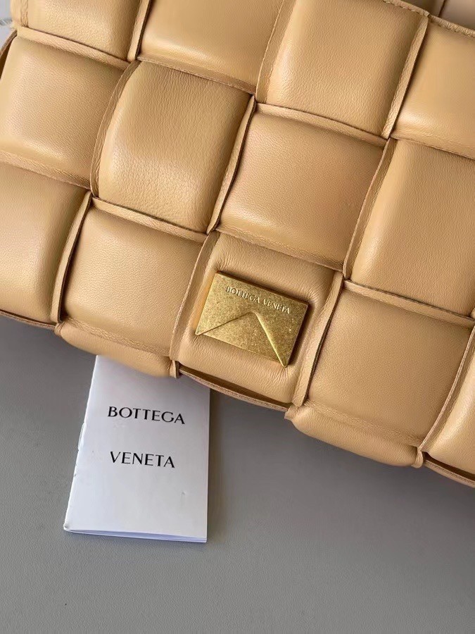 bo*te*ga Ve*ne*ta padded cassette bag in almond lambskin