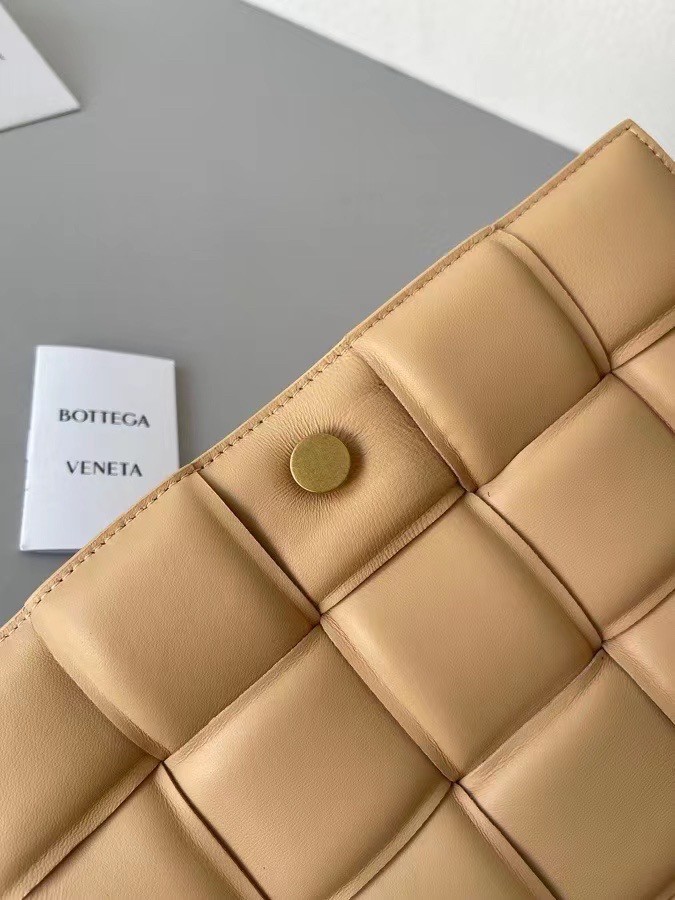 bo*te*ga Ve*ne*ta padded cassette bag in almond lambskin