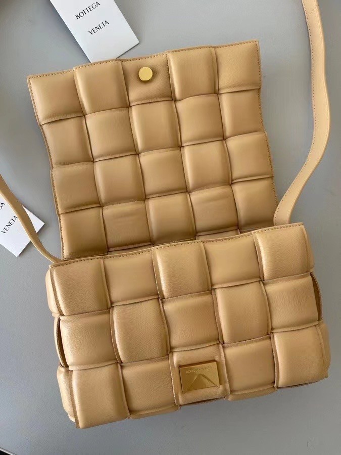 bo*te*ga Ve*ne*ta padded cassette bag in almond lambskin