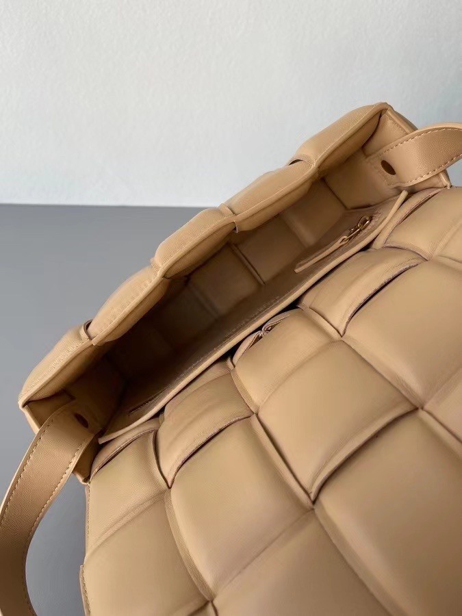 bo*te*ga Ve*ne*ta padded cassette bag in almond lambskin