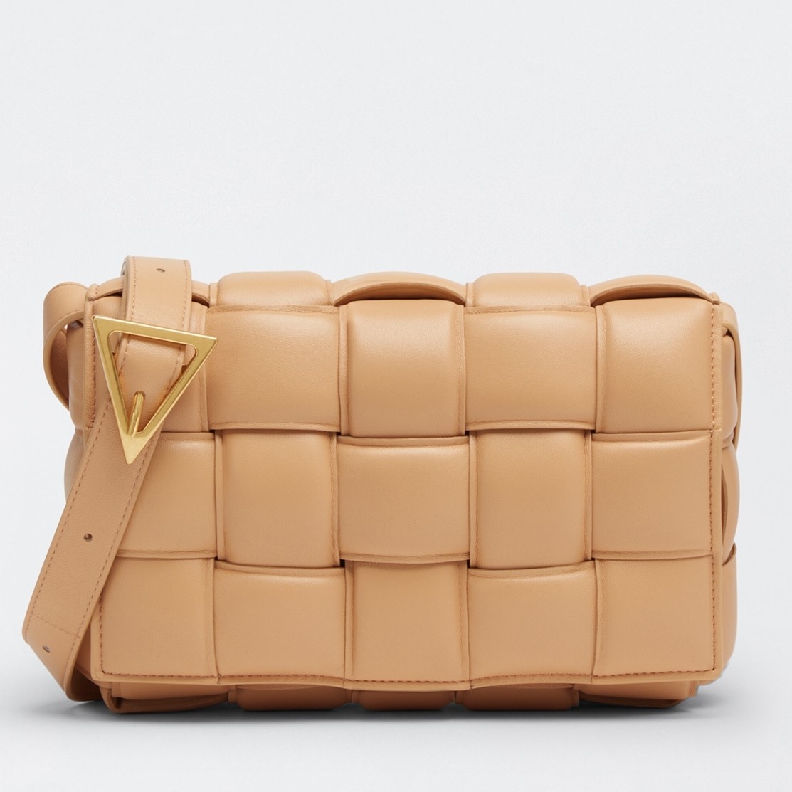 bo*te*ga Ve*ne*ta padded cassette bag in almond lambskin