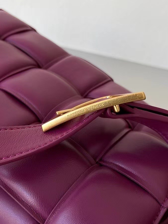 bo*te*ga Ve*ne*ta padded cassette bag in cinnabar lambskin
