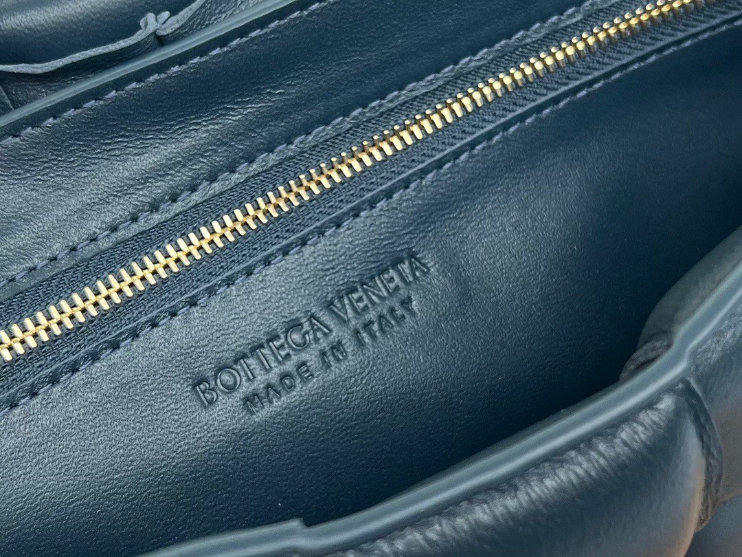 bo*te*ga Ve*ne*ta padded cassette bag in dark blue intrecciato lambskin