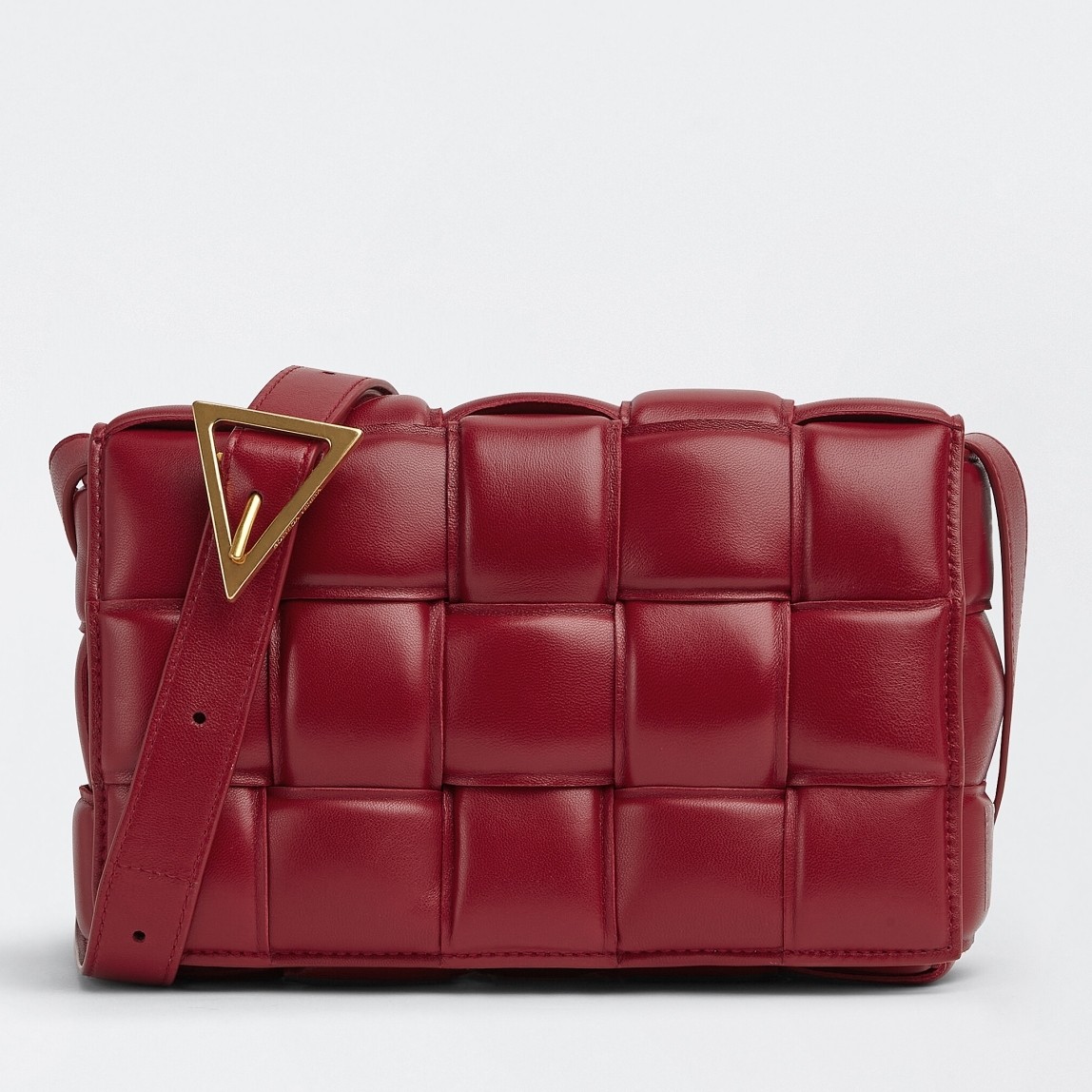 bo*te*ga Ve*ne*ta padded cassette bag in dard red lambskin