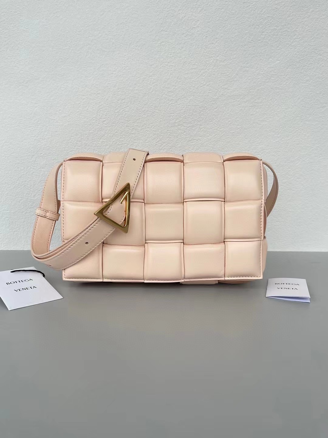 bo*te*ga Ve*ne*ta padded cassette bag in melon lambskin