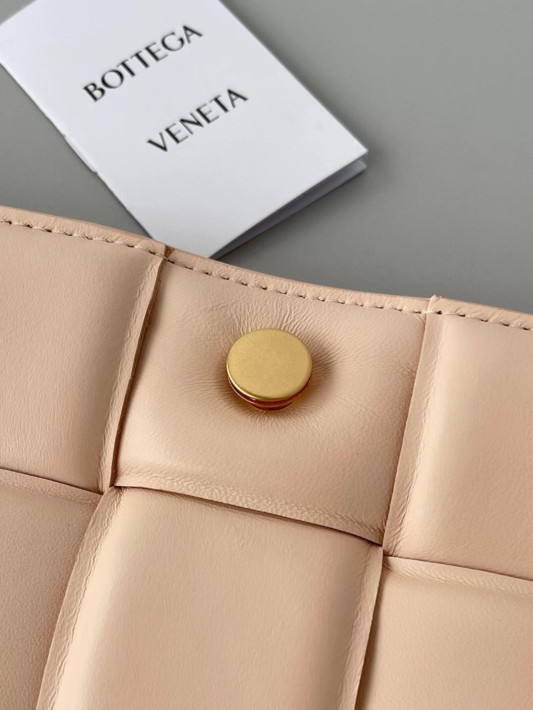 bo*te*ga Ve*ne*ta padded cassette bag in melon lambskin