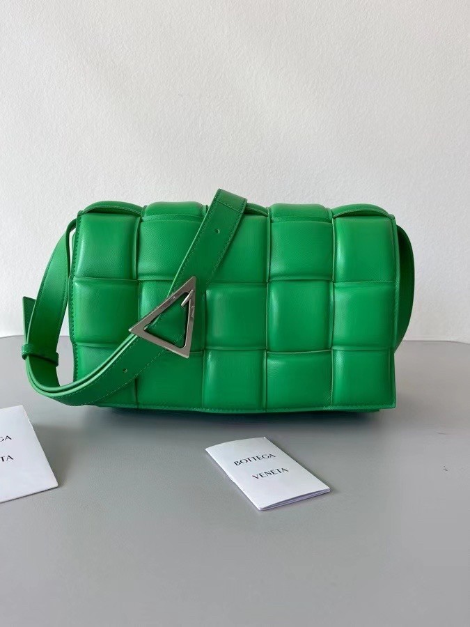 bo*te*ga Ve*ne*ta padded cassette bag in green lambskin