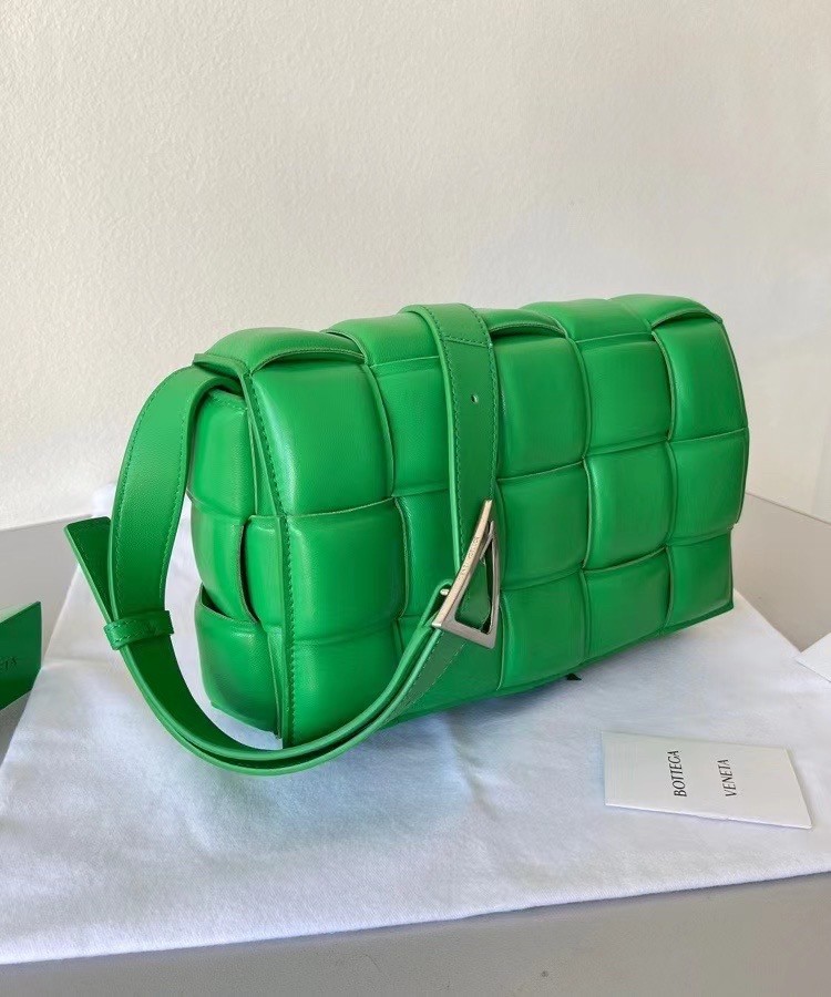 bo*te*ga Ve*ne*ta padded cassette bag in green lambskin
