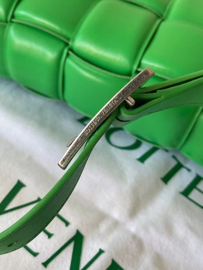 bo*te*ga Ve*ne*ta padded cassette bag in green lambskin