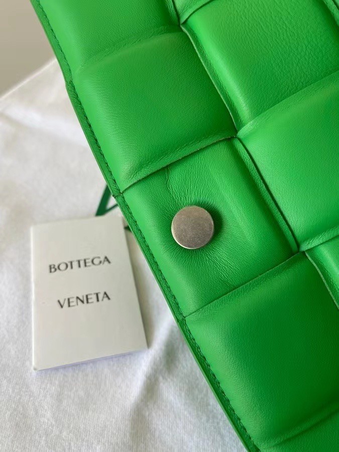 bo*te*ga Ve*ne*ta padded cassette bag in green lambskin