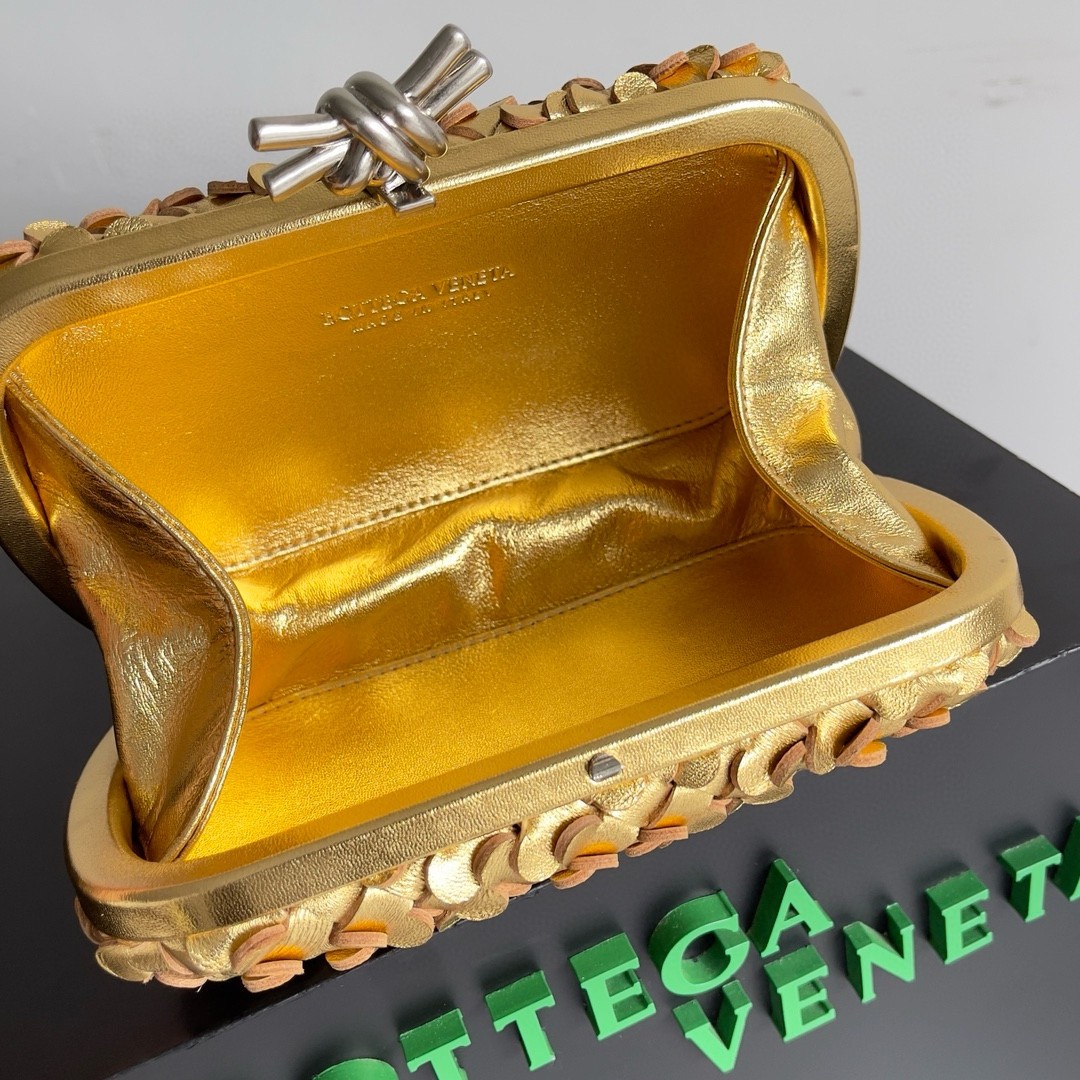 bo*te*ga Ve*ne*ta knot minaudiere clutch in gold sequins laminated leather