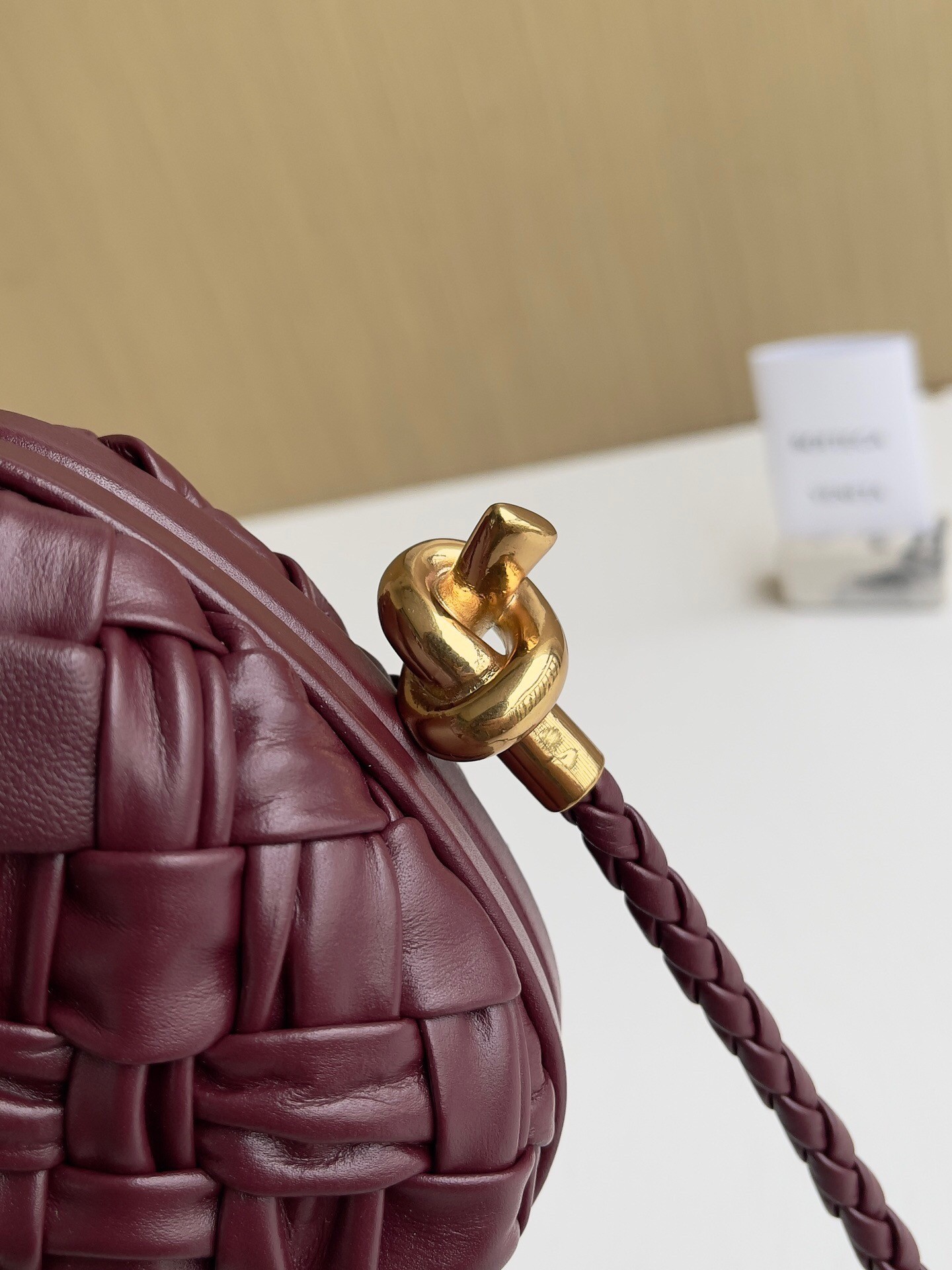 bo*te*ga Ve*ne*ta knot minaudiere on strap in barolo foulard intreccio leather