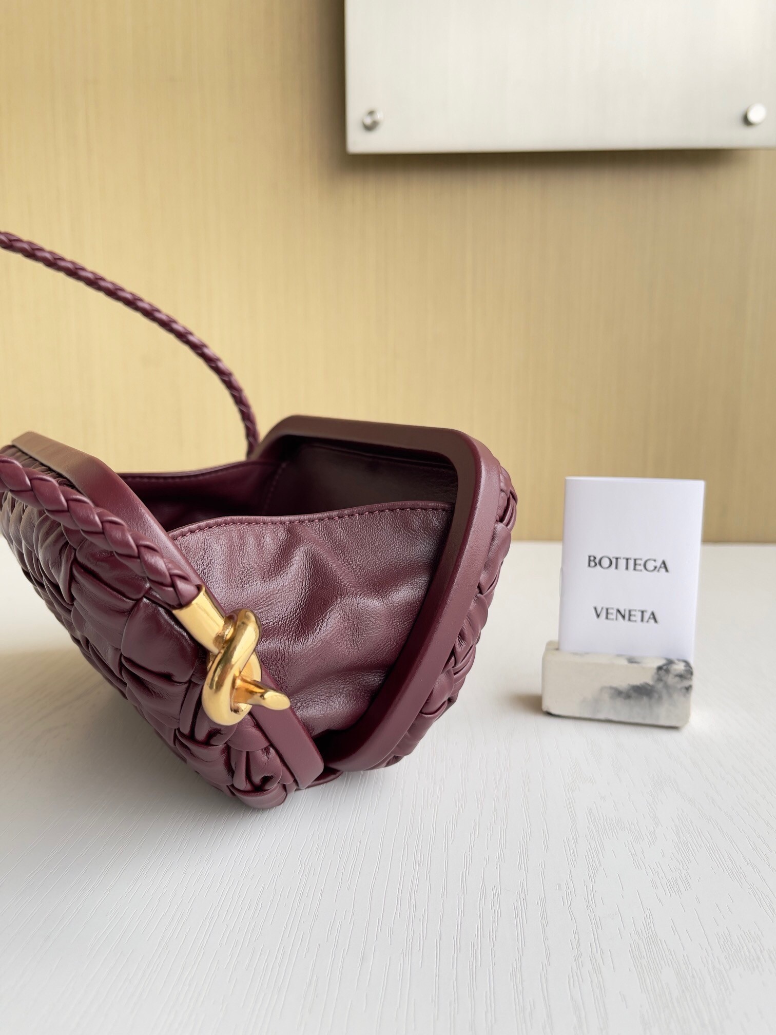 bo*te*ga Ve*ne*ta knot minaudiere on strap in barolo foulard intreccio leather