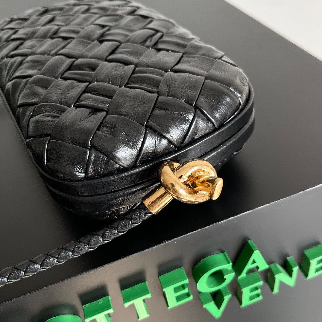 bo*te*ga Ve*ne*ta knot minaudiere on strap in black foulard intreccio leather