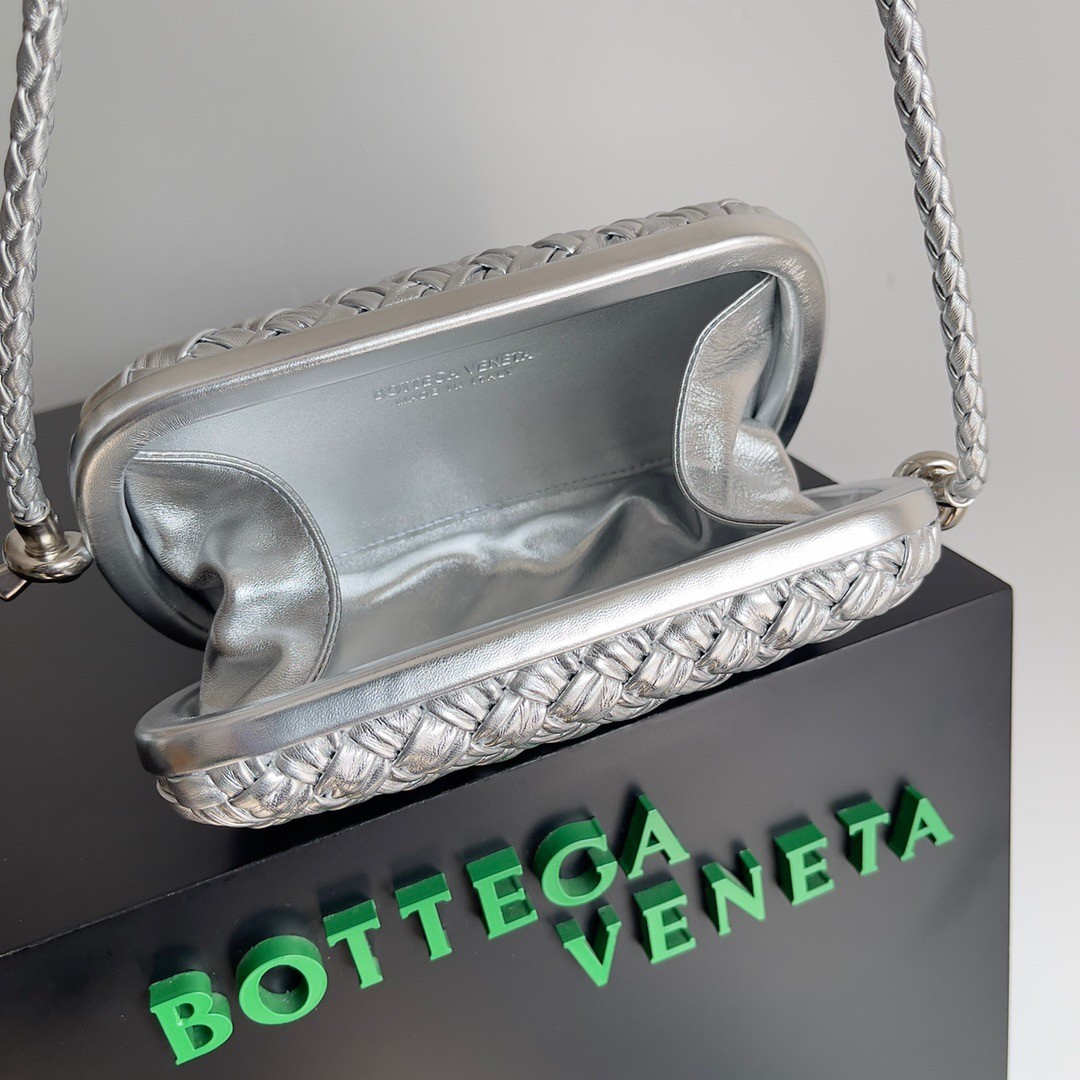bo*te*ga Ve*ne*ta knot minaudiere on strap in silver intreccio laminated leather