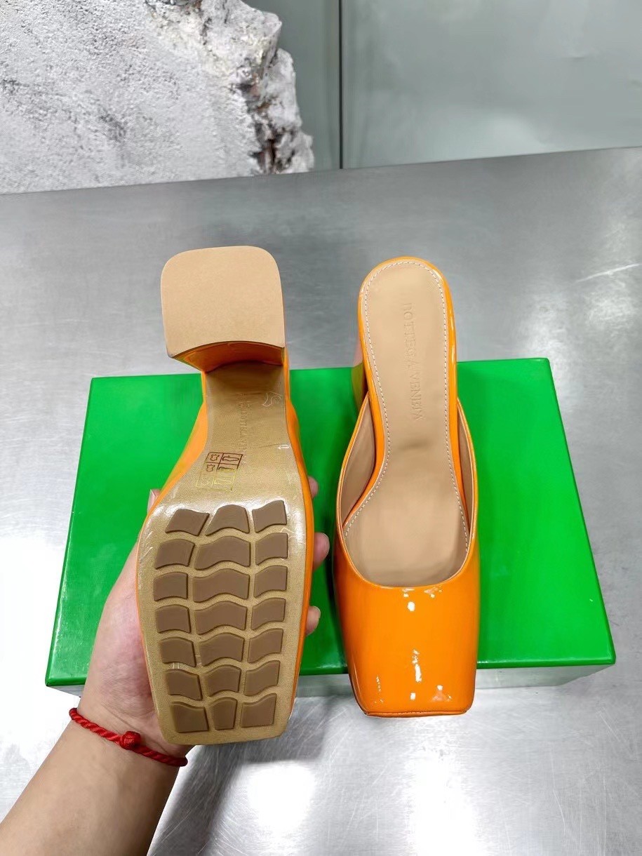 bo*te*ga Ve*ne*ta tower mules in orange patent calfskin