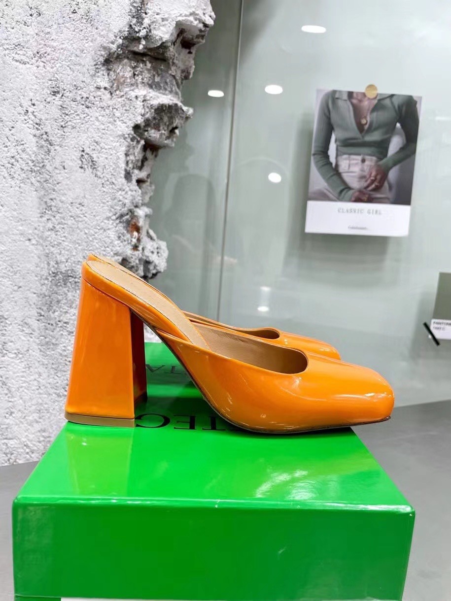 bo*te*ga Ve*ne*ta tower mules in orange patent calfskin