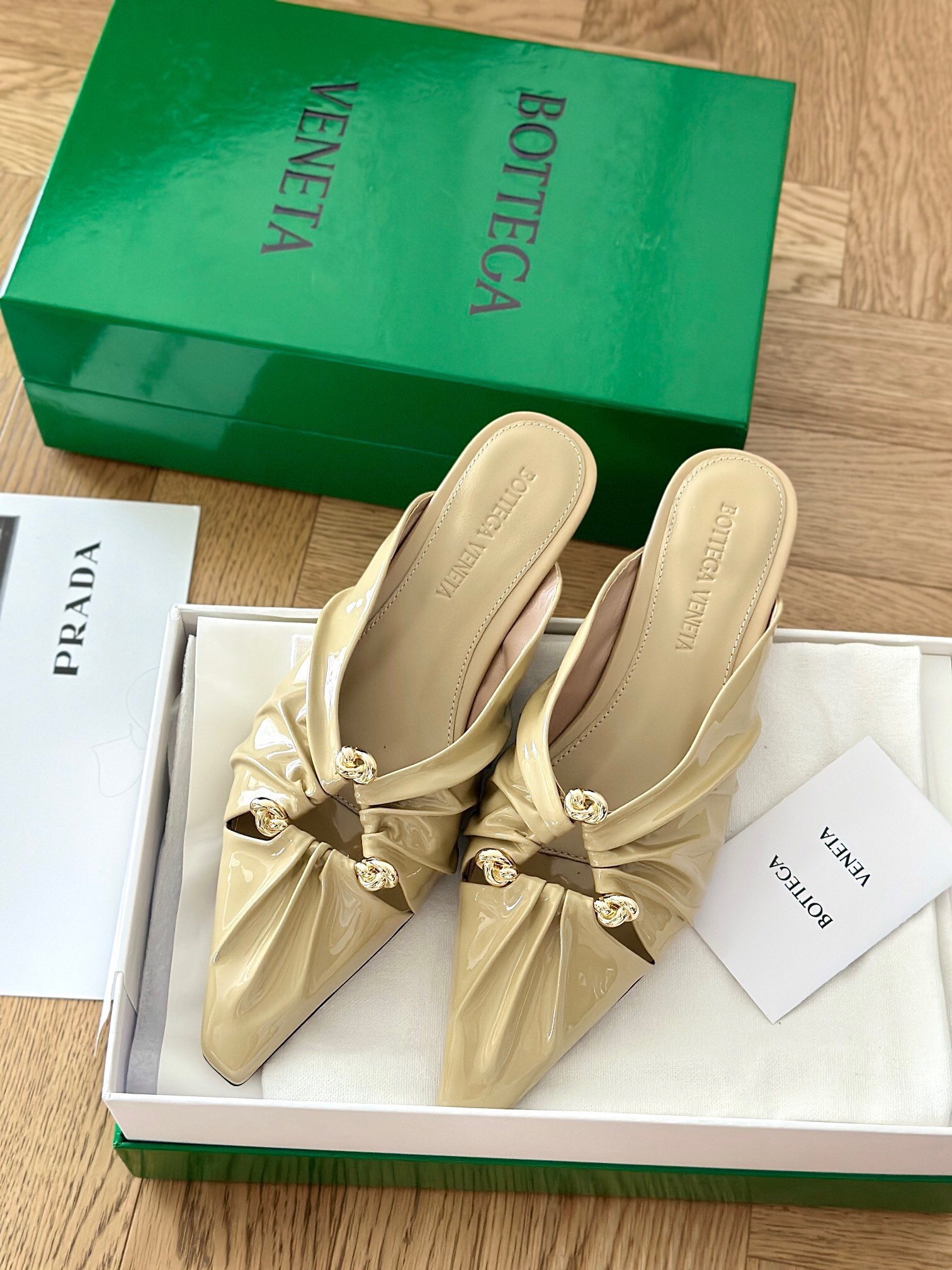 bo*te*ga Ve*ne*ta bunnie flat mules in beige patent leather