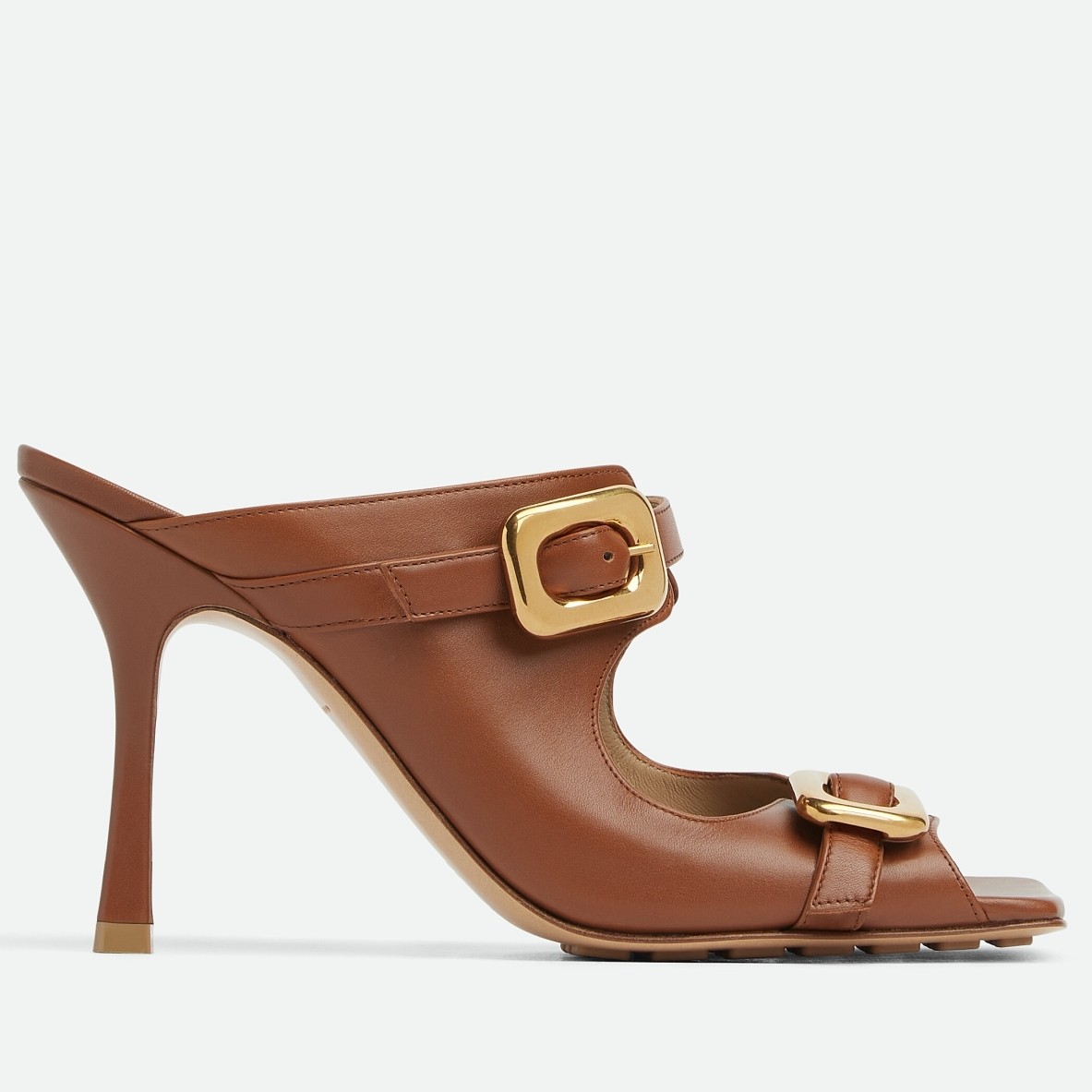 bo*te*ga Ve*ne*ta stretch buckle mules in caramel calfskin