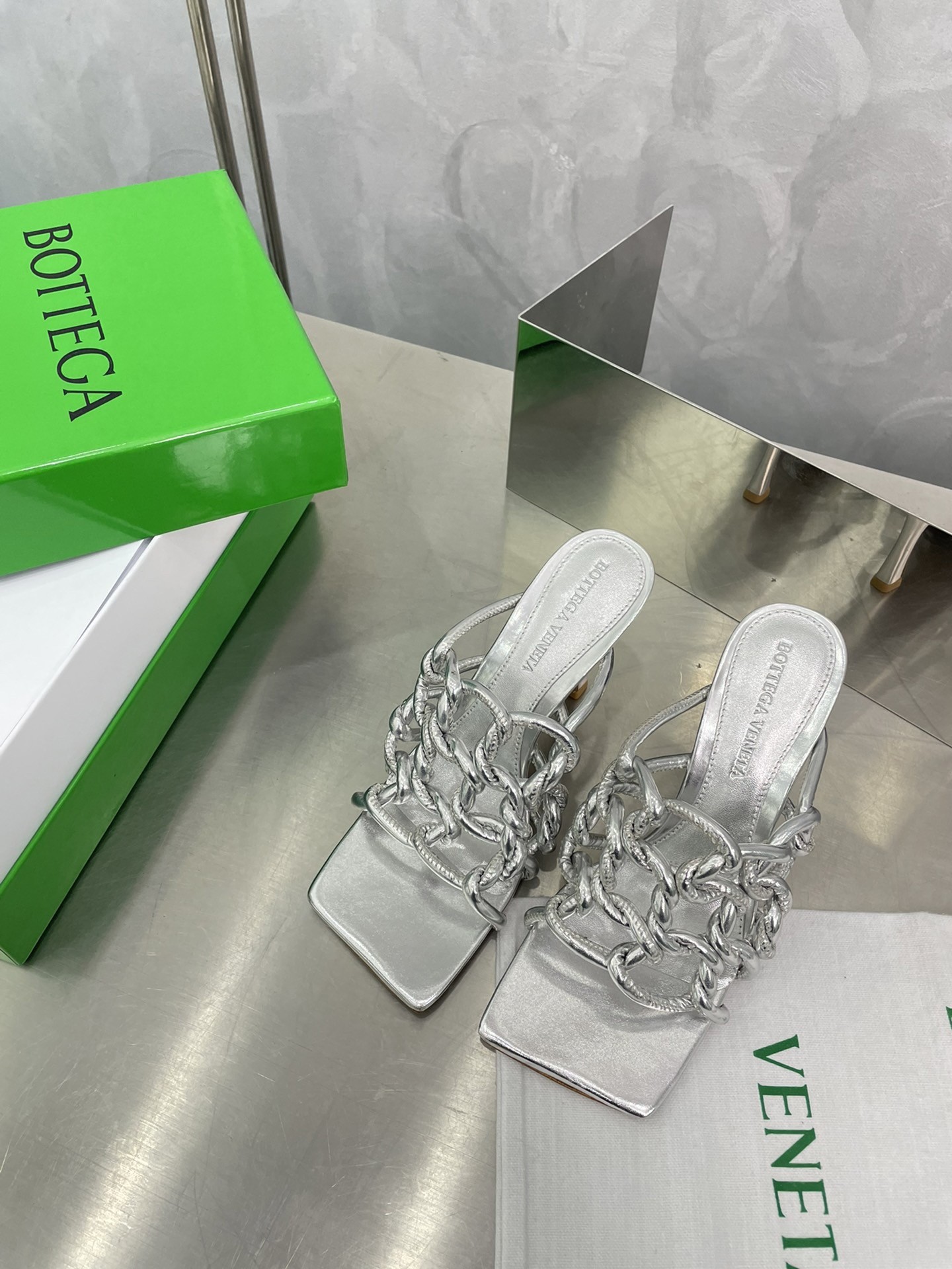 bo*te*ga Ve*ne*ta stretch twist sandals in silver metallic lambskin