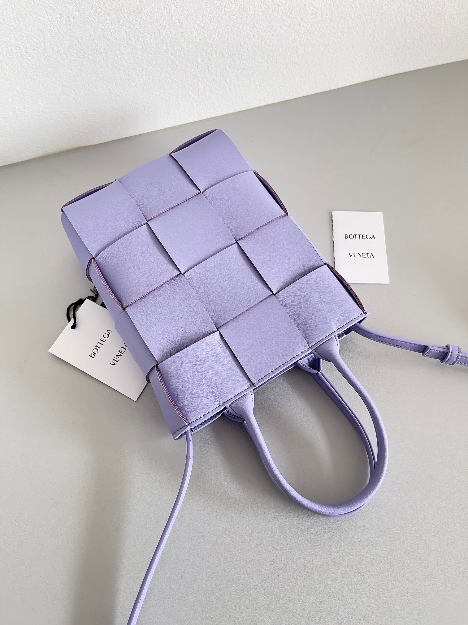bo*te*ga Ve*ne*ta mini cassette tote bag in wisteria lambskin