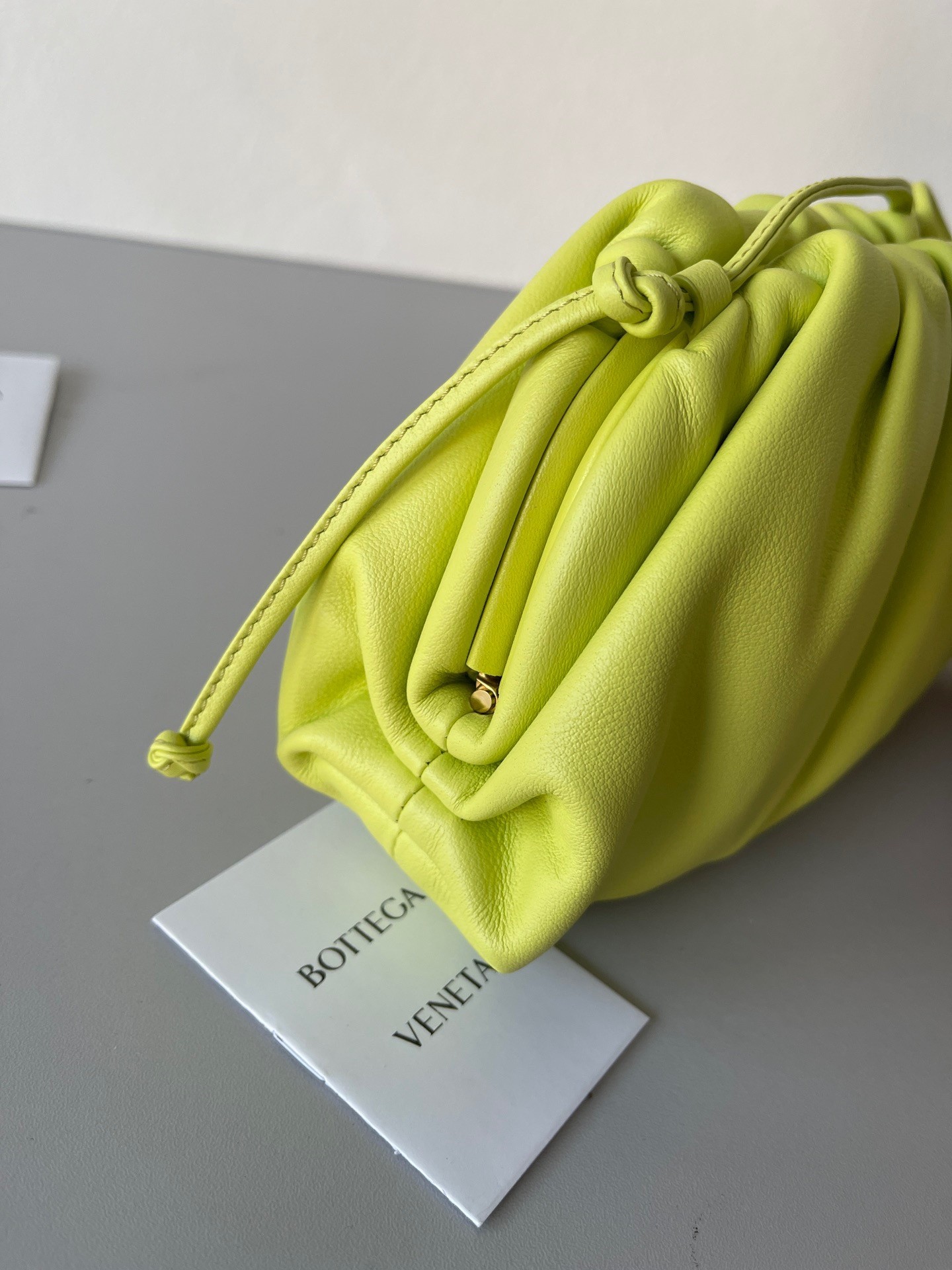 bo*te*ga Ve*ne*ta mini pouch bag in kiwi calfskin