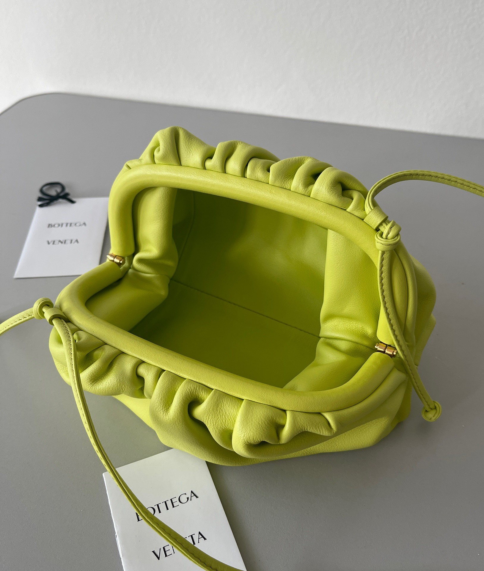 bo*te*ga Ve*ne*ta mini pouch bag in kiwi calfskin