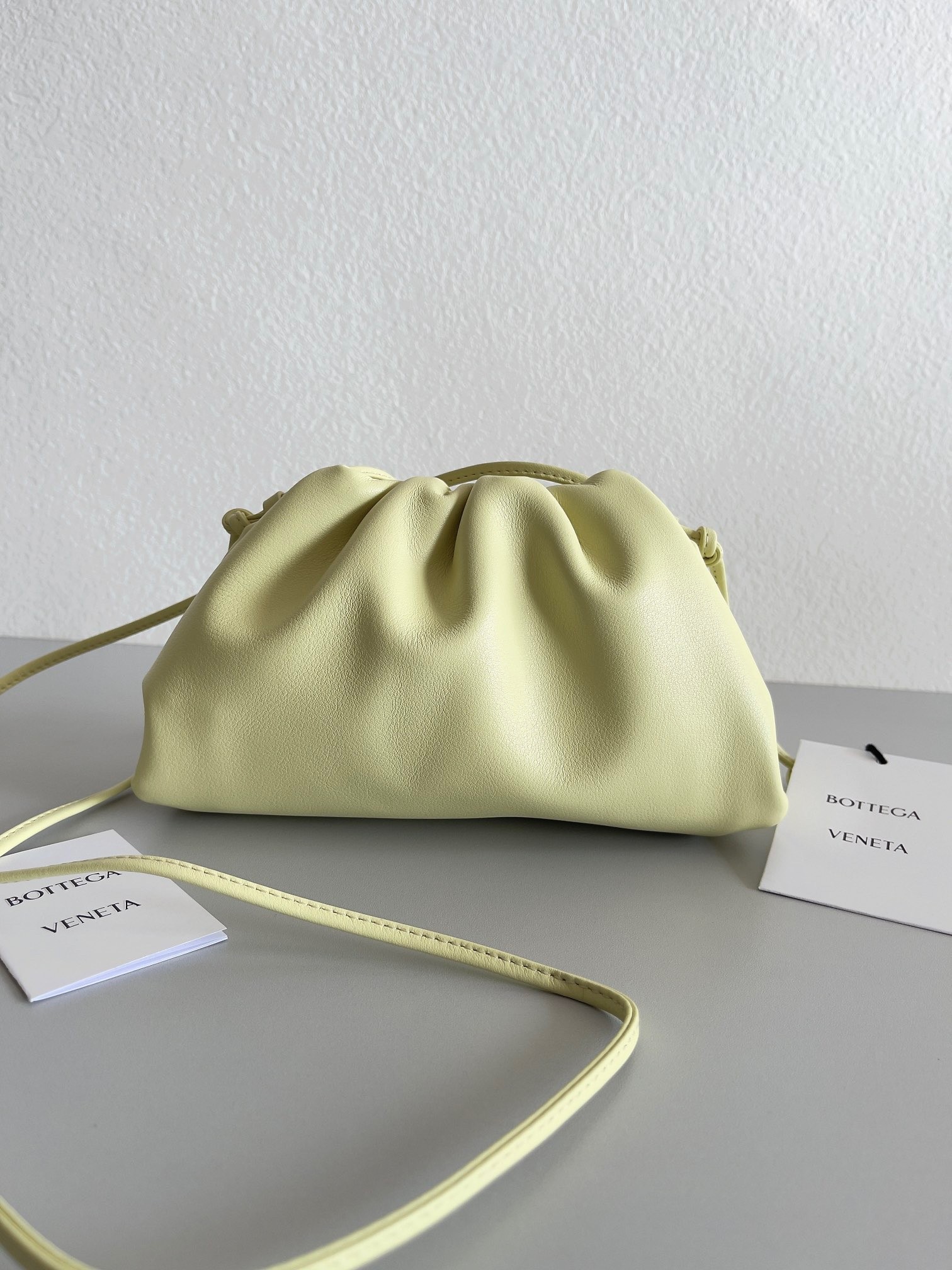 bo*te*ga Ve*ne*ta mini pouch bag in zest washed calfskin