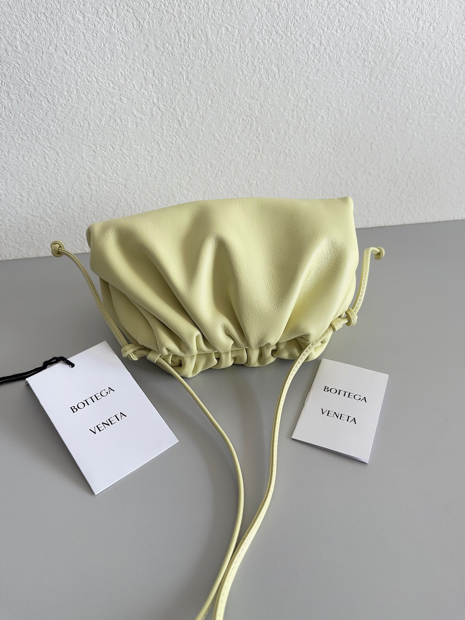 bo*te*ga Ve*ne*ta mini pouch bag in zest washed calfskin