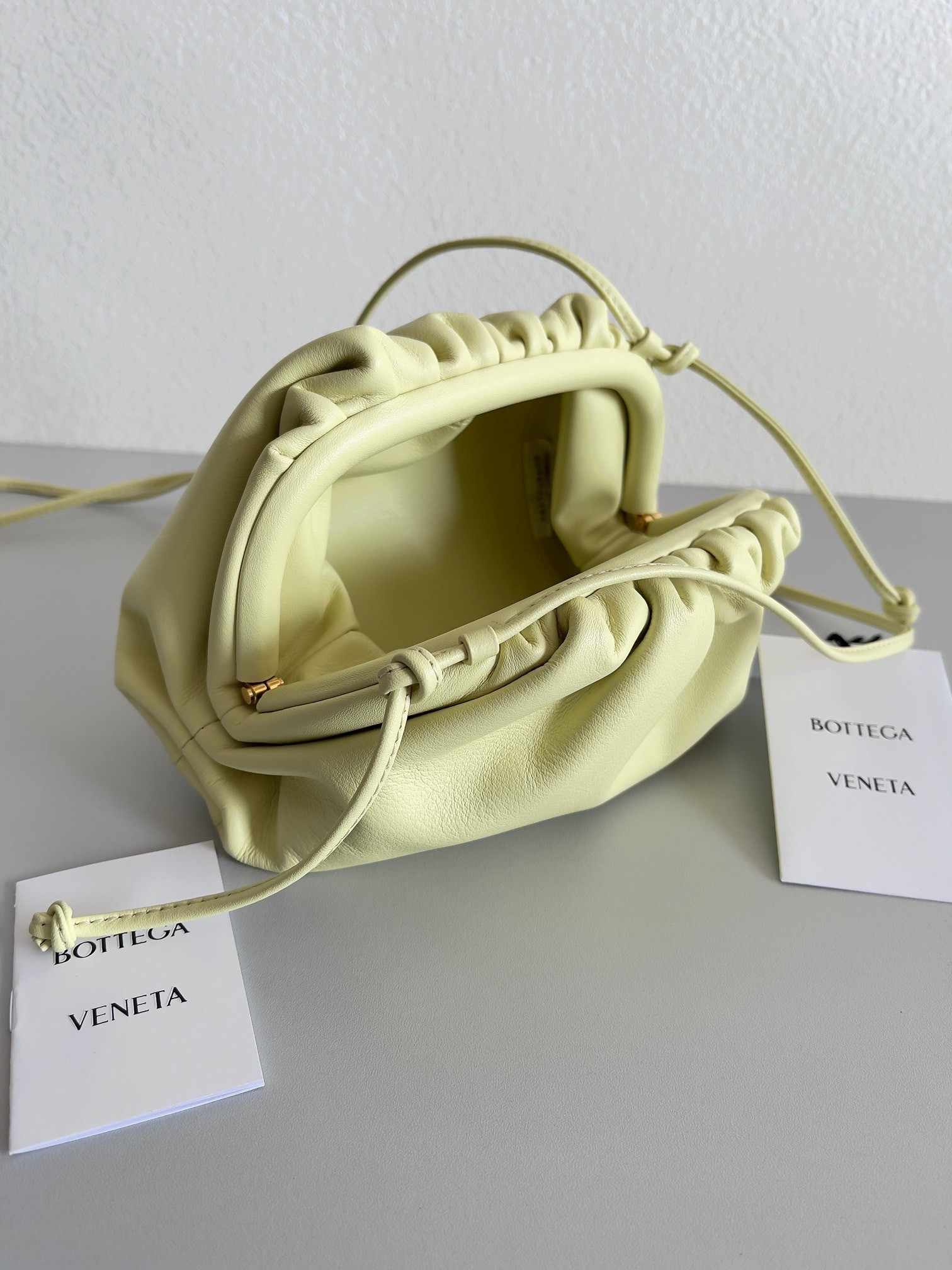 bo*te*ga Ve*ne*ta mini pouch bag in zest washed calfskin