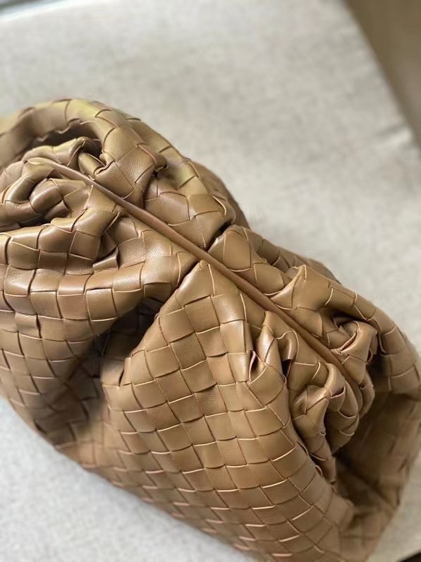 bo*te*ga Ve*ne*ta large pouch clutch in caramel intrecciato lambskin