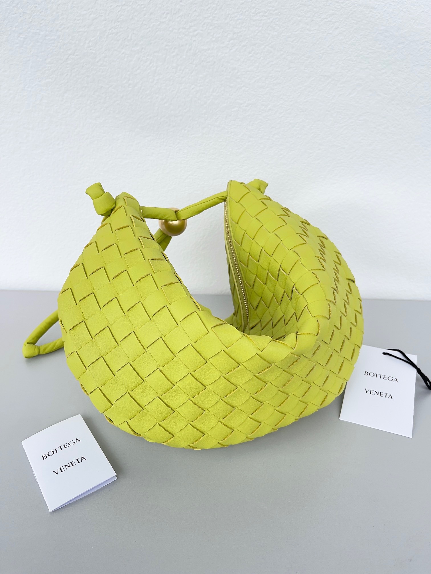 bo*te*ga Ve*ne*ta turn bag in acid kiwi intrecciato lambskin