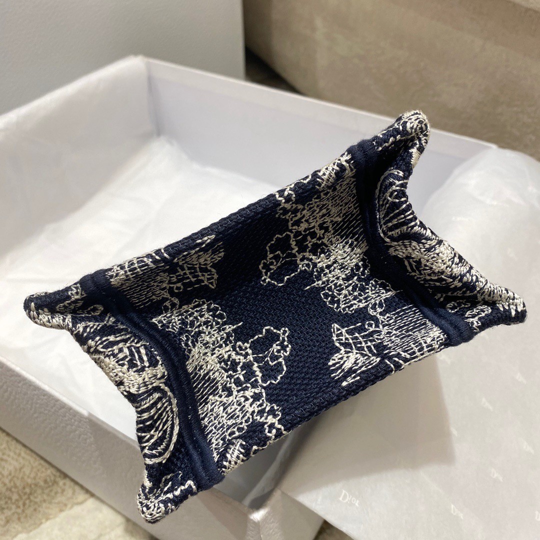 D*or mini book tote phone bag in blue toile de jouy reverse embroidery