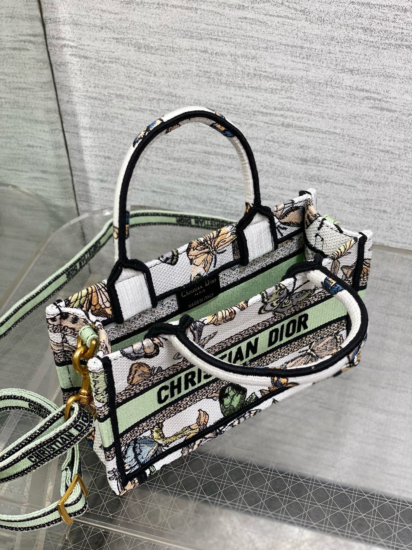 D*or mini book tote with strap in white toile de jouy mexico embroidery
