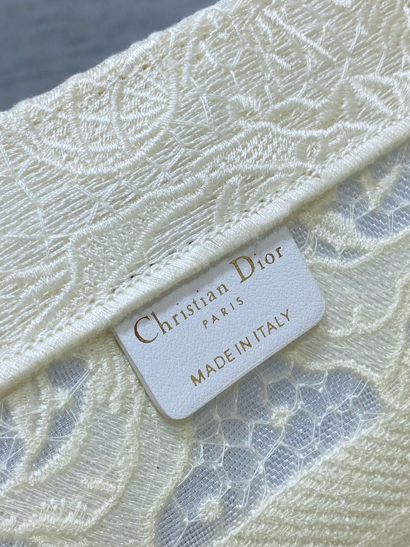 D*or medium book tote bag in white toile de jouy soleil macramé embroidery