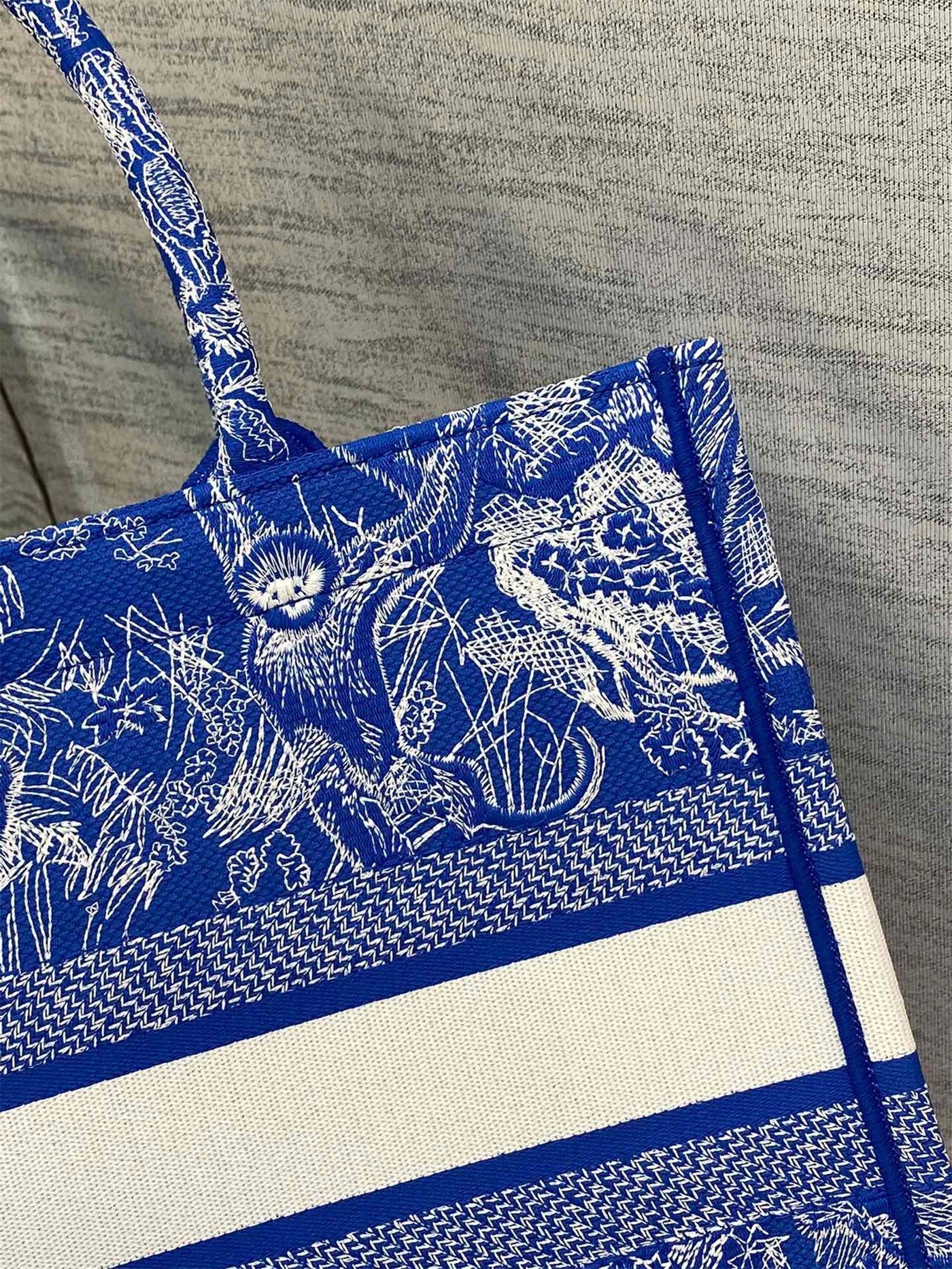 D*or medium book tote bag in fluorescent blue toile de jouy reverse embroidery