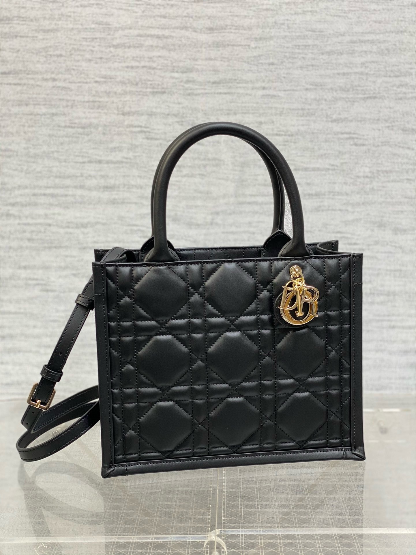 D*or small book tote bag with strap in black macrocannage calfskin