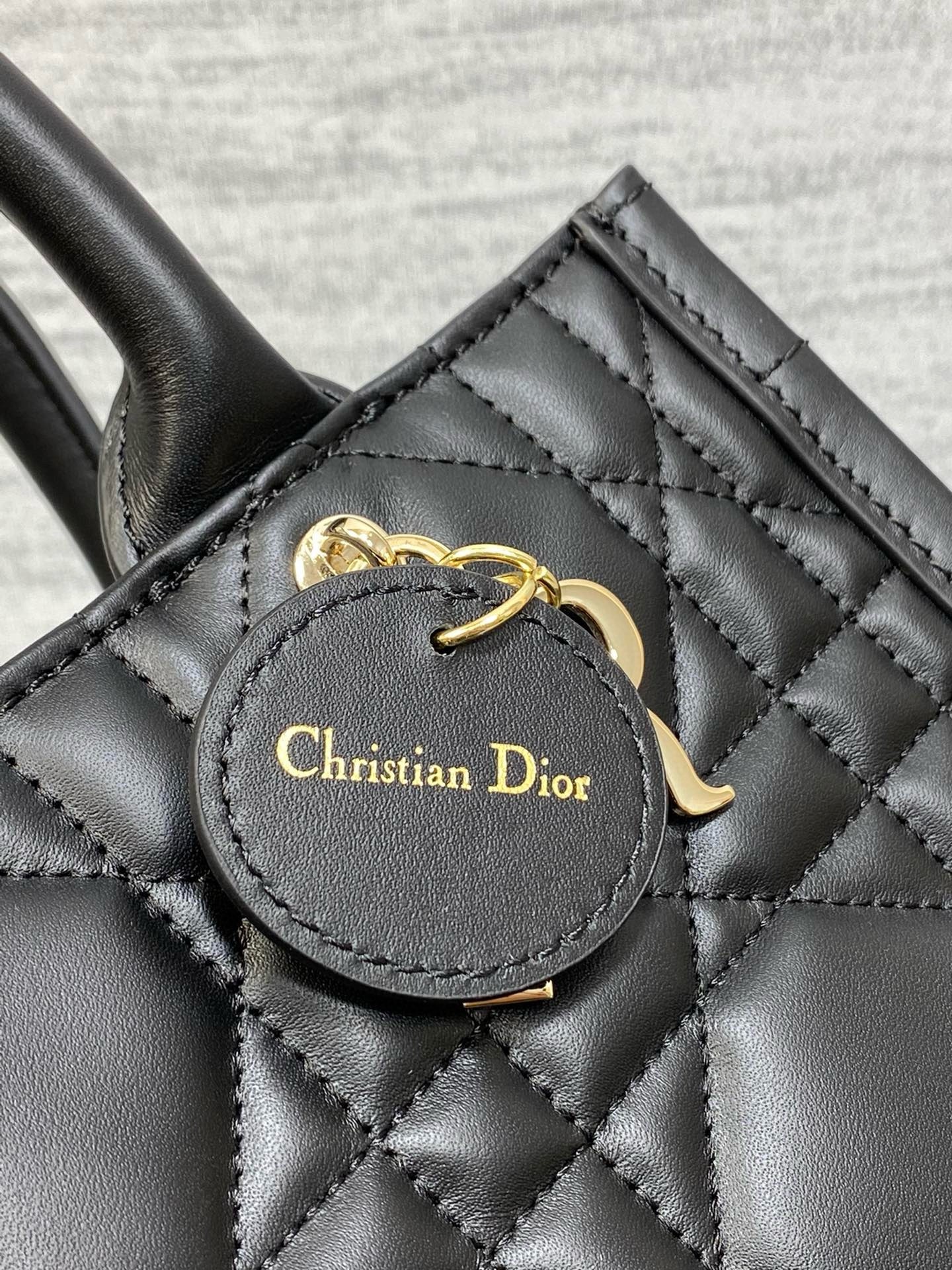D*or small book tote bag with strap in black macrocannage calfskin