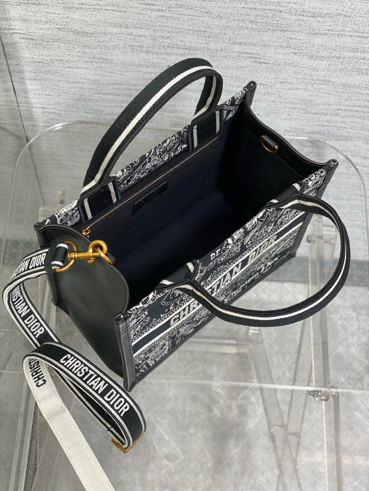 D*or small book tote bag with strap in plan de paris embroidery and black calfskin