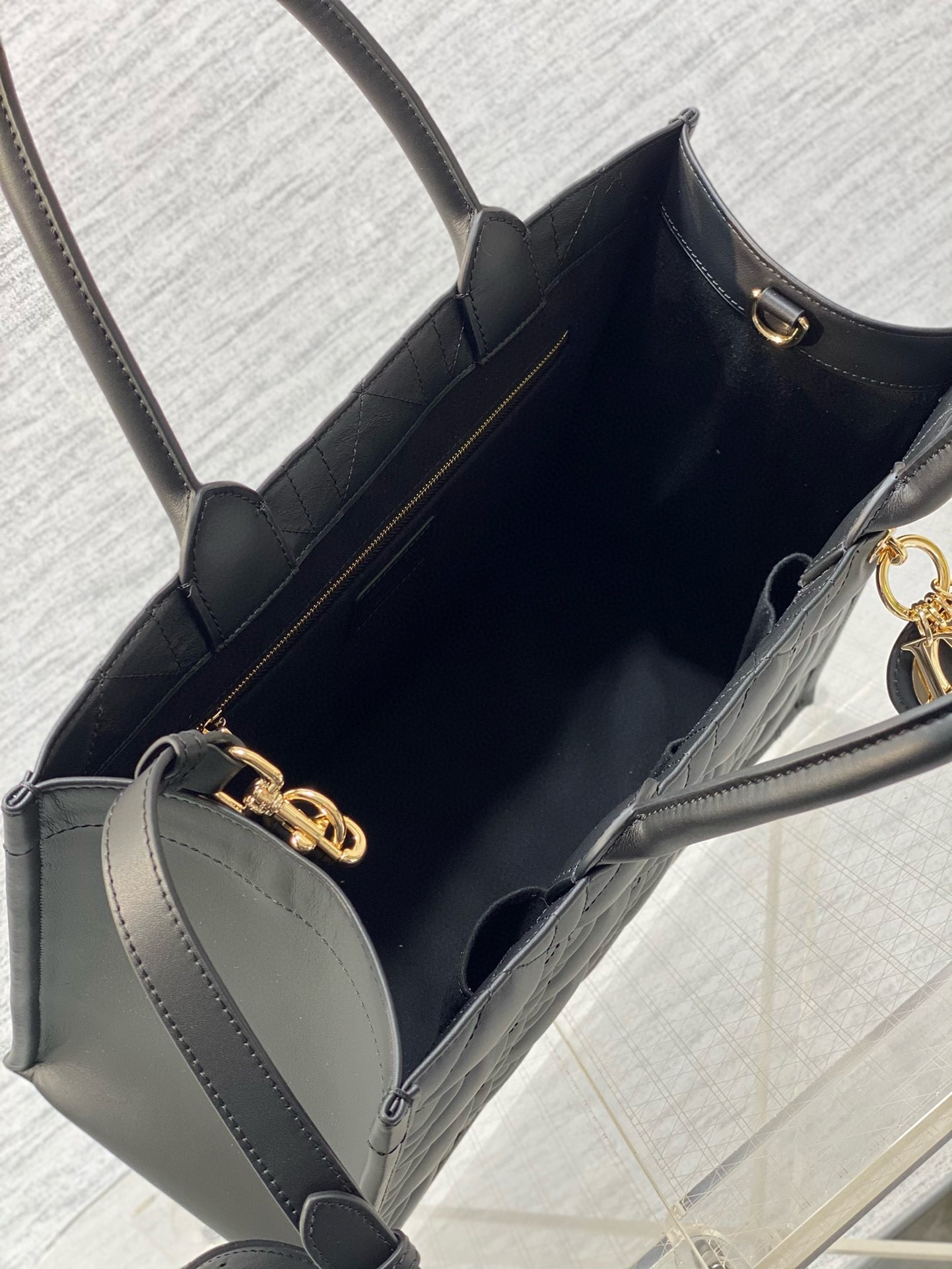 D*or medium book tote bag with strap in black macrocannage calfskin