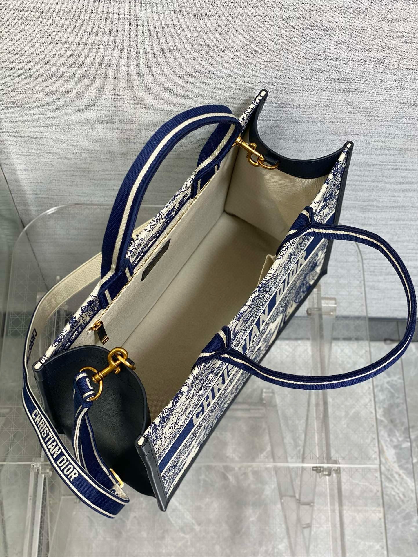 D*or medium book tote bag with strap in blue toile de jouy sauvage embroidery