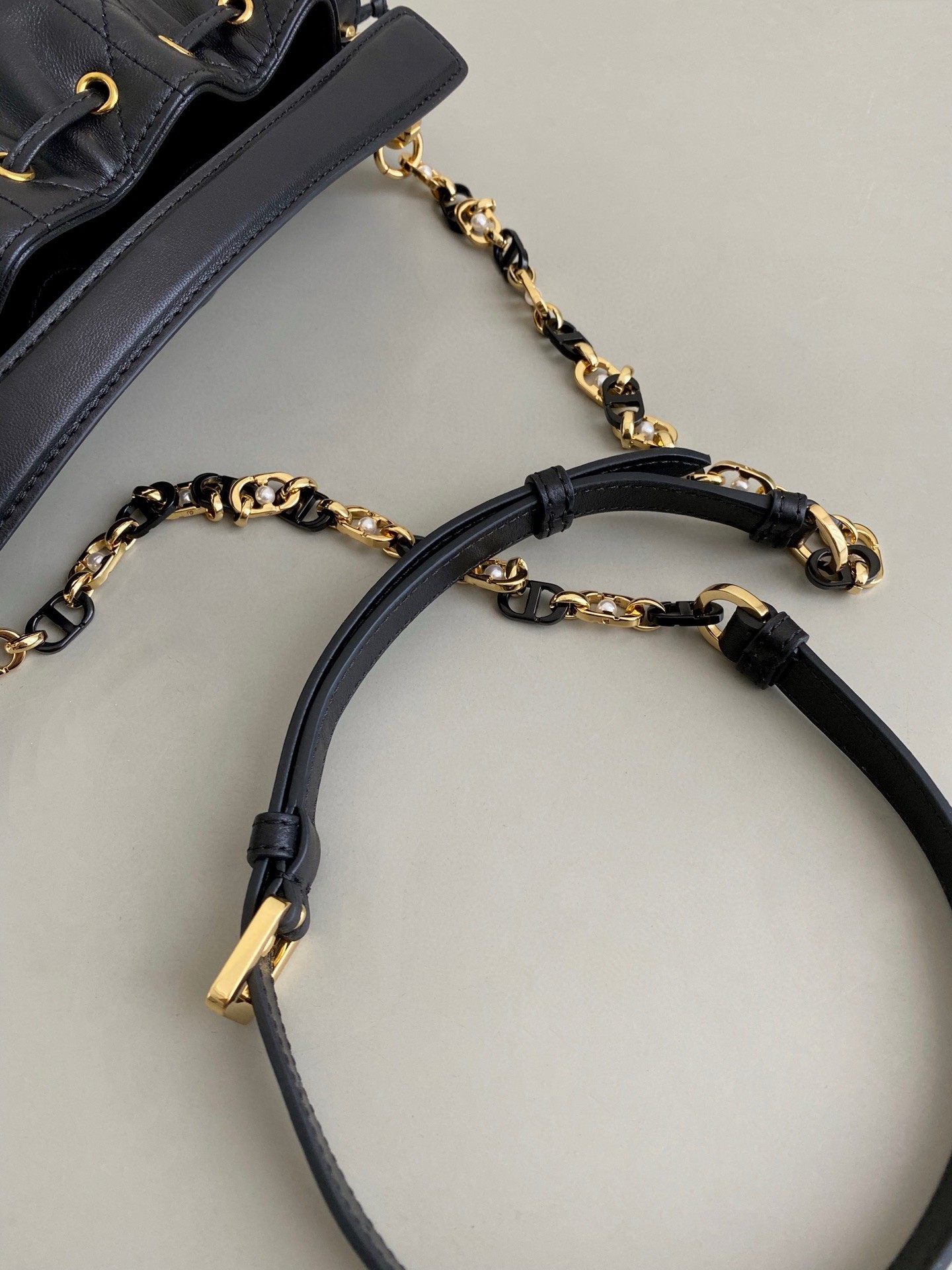 D*or small jolie bucket bag in black macrocannage lambskin