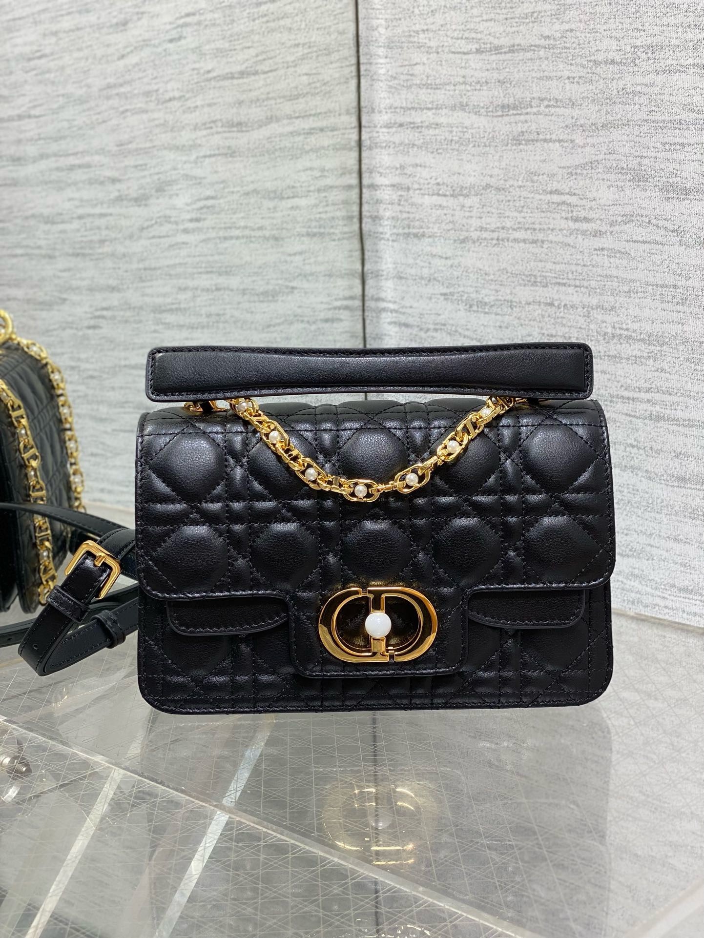 D*or small jolie top handle bag in black cannage calfskin