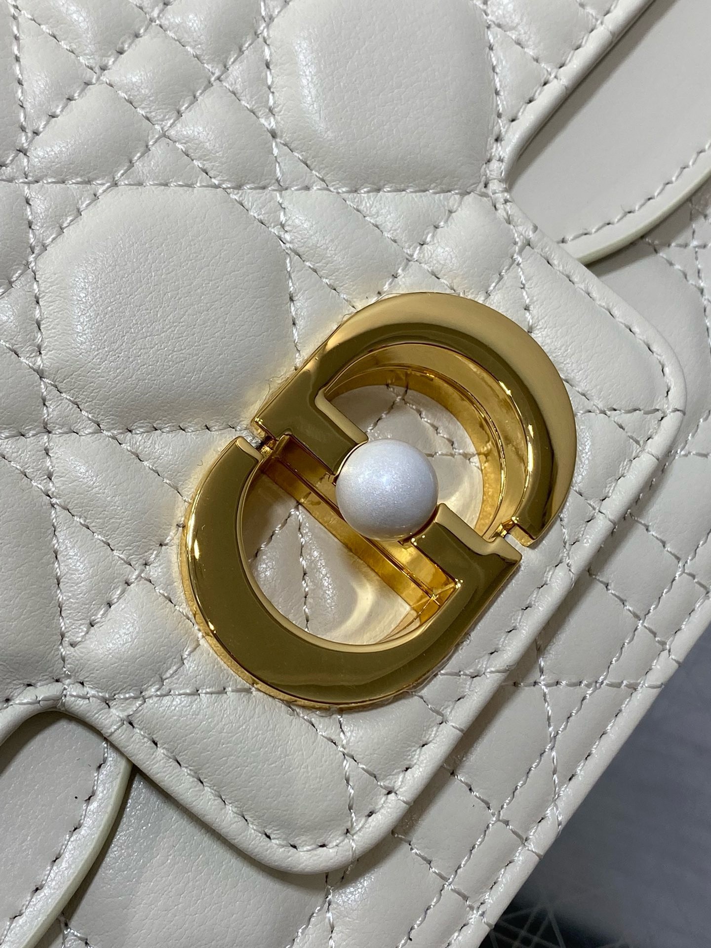 D*or small jolie top handle bag in white cannage calfskin