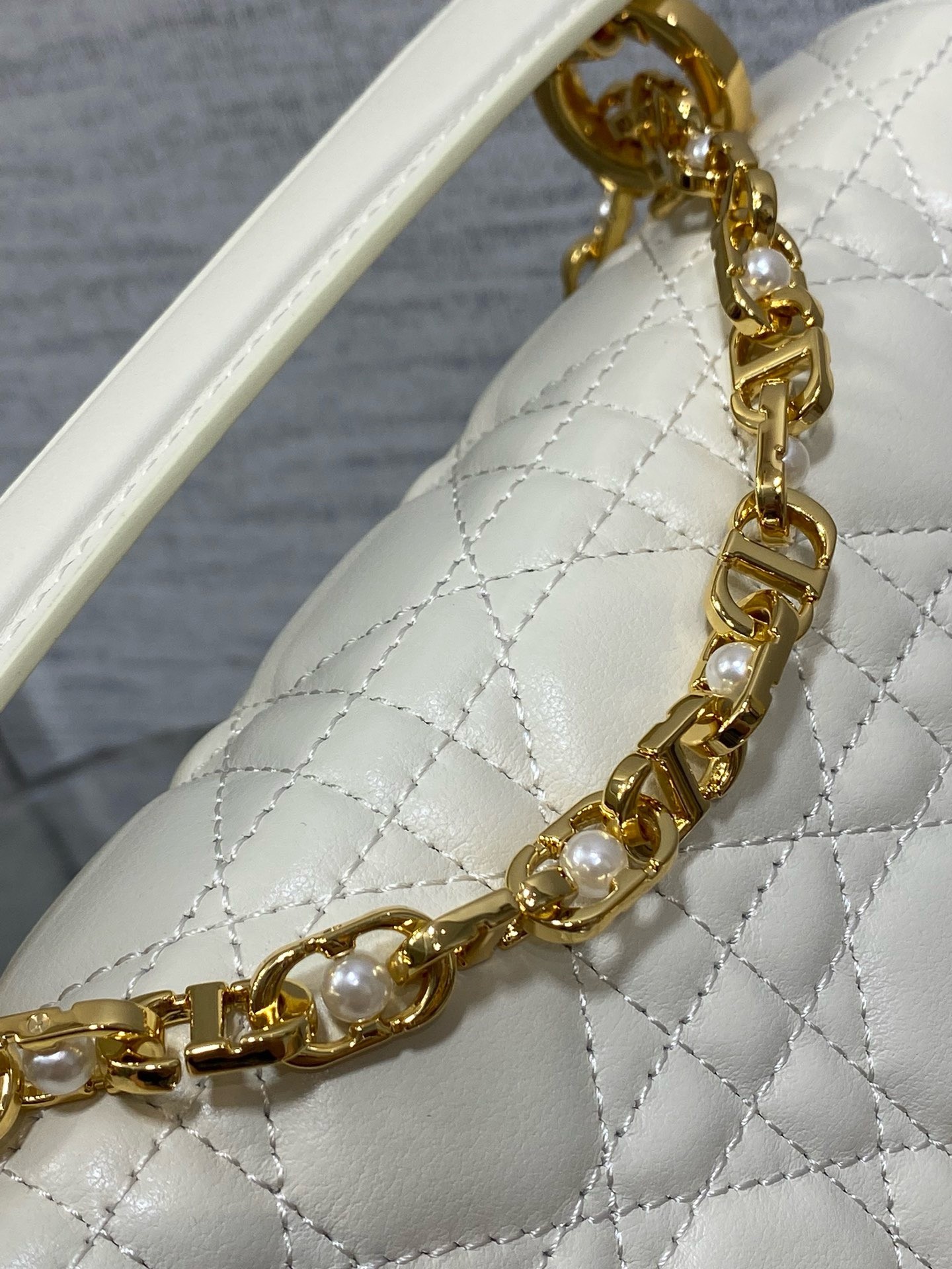 D*or small jolie top handle bag in white cannage calfskin