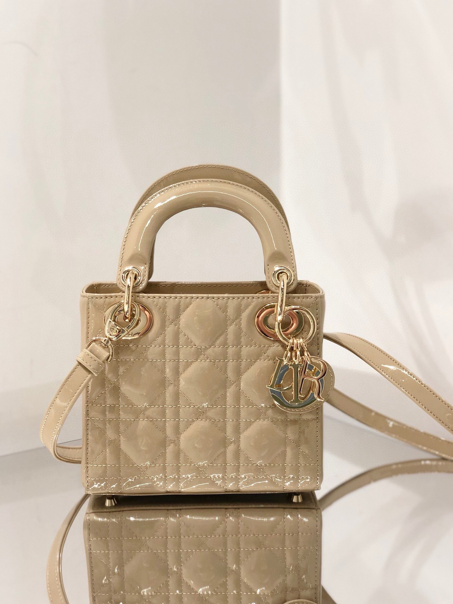 D*or lady D*or mini chain bag with chain in aesthetic beige patent calfskin