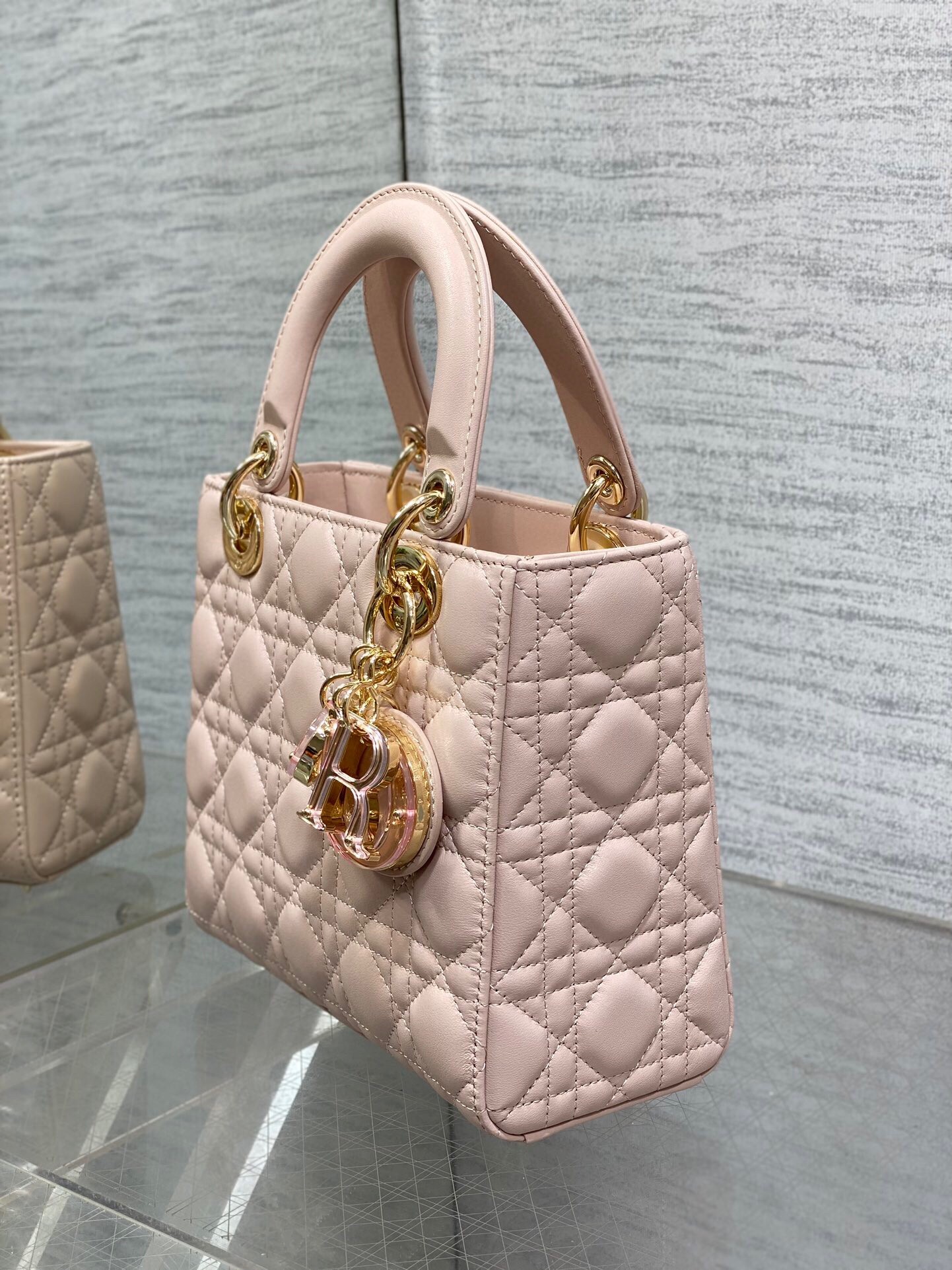 D*or small lady D*or bag in pink lambskin with resin charms