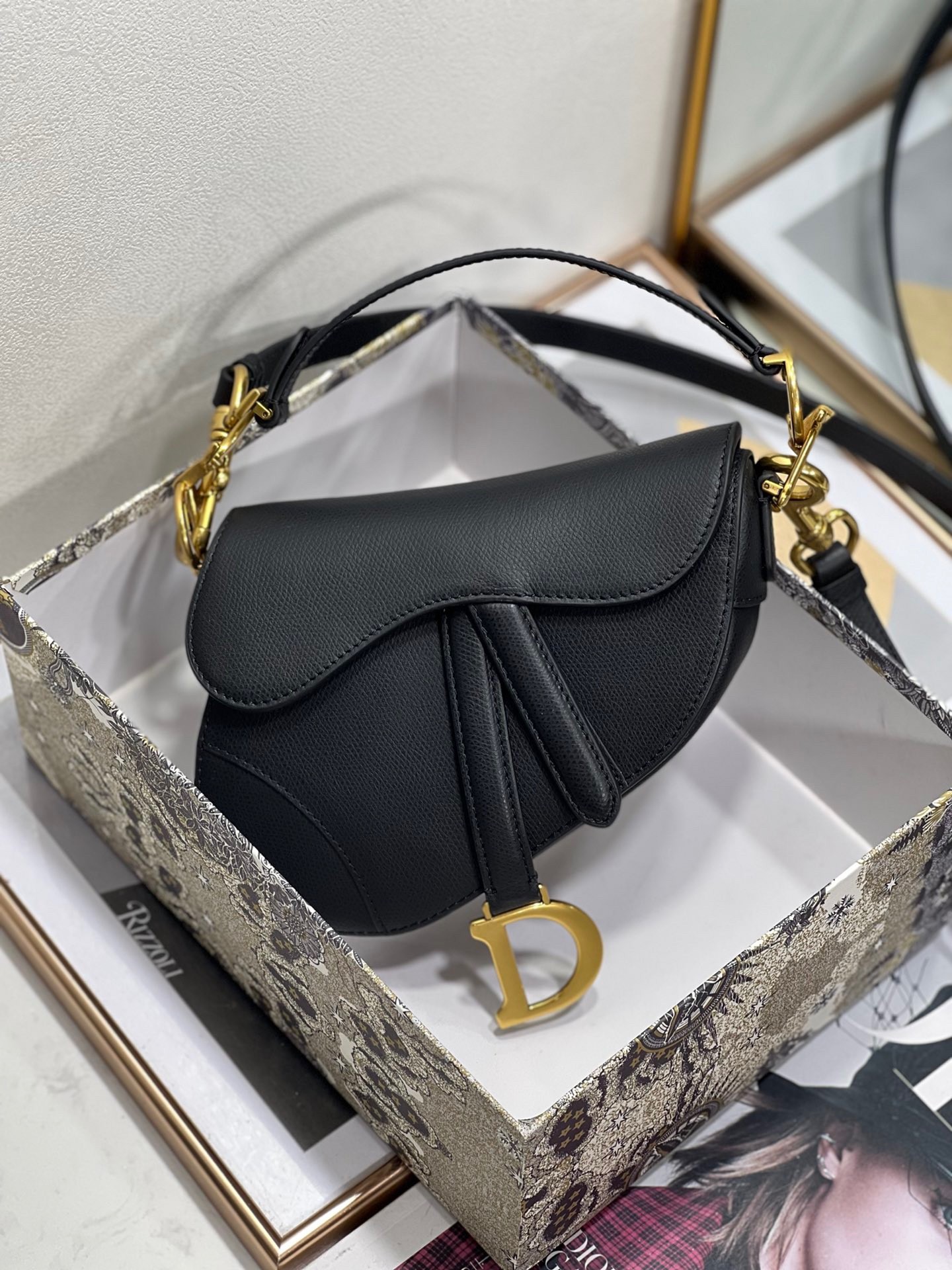 D*or saddle mini bag with strap in black grained calfskin